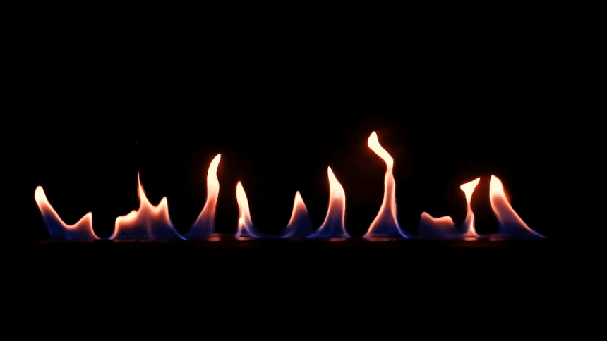 Flames from renewable gas against a dark background