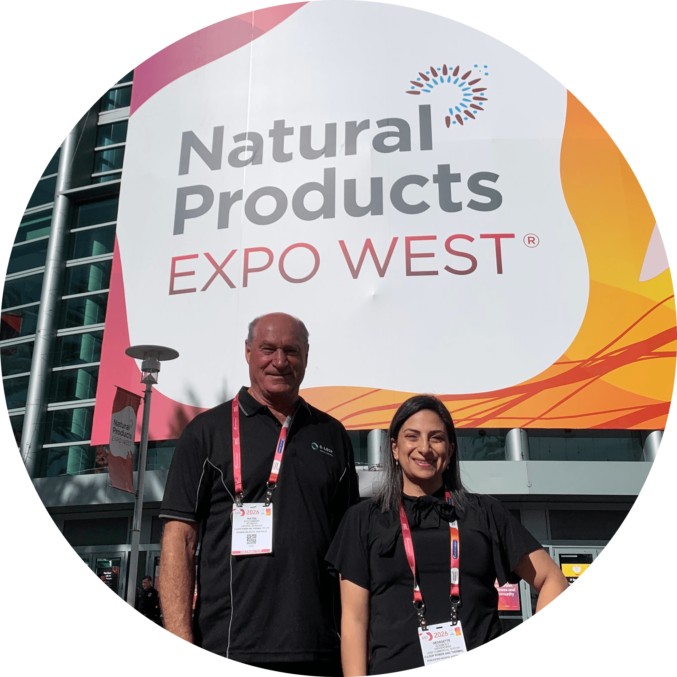 The C-Loop Team stands outside the entry to Natural Products Expo West 2026